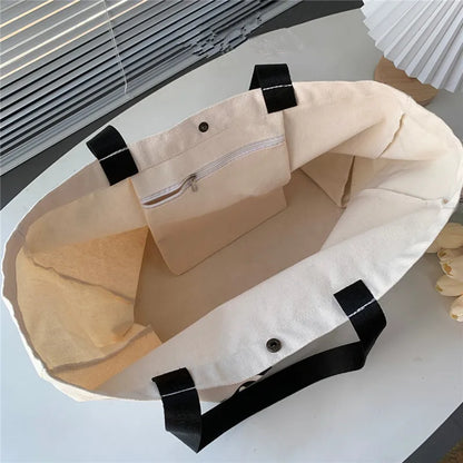 The Voyage Tote: The Gloss Take on a Timeless Essential